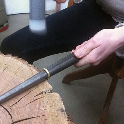 forging a wedding ring with a hammer